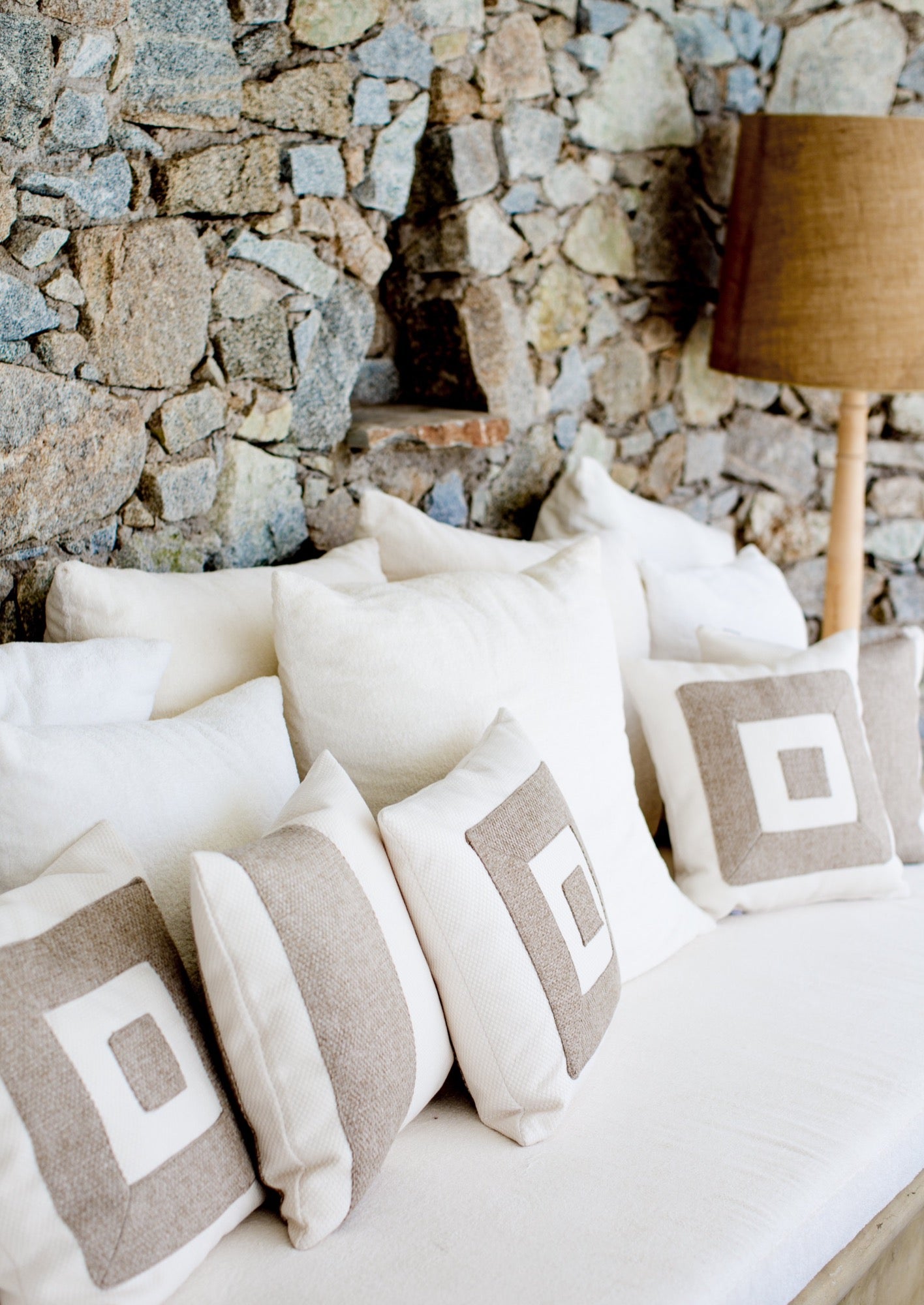 Themis Z handmade cushion adorned with a hand-stitched pattern.