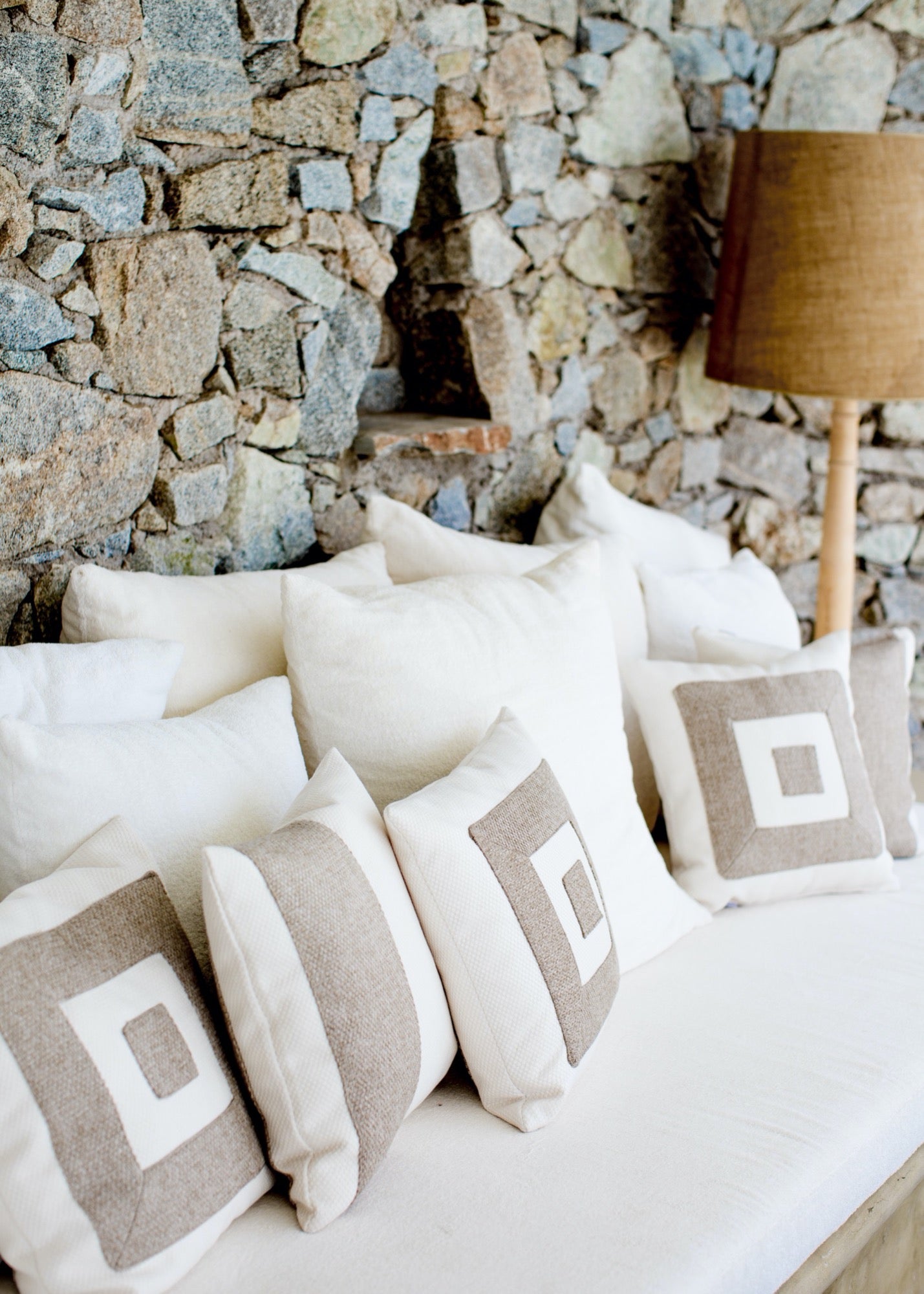 Themis Z handmade cushion adorned with a hand-stitched pattern.