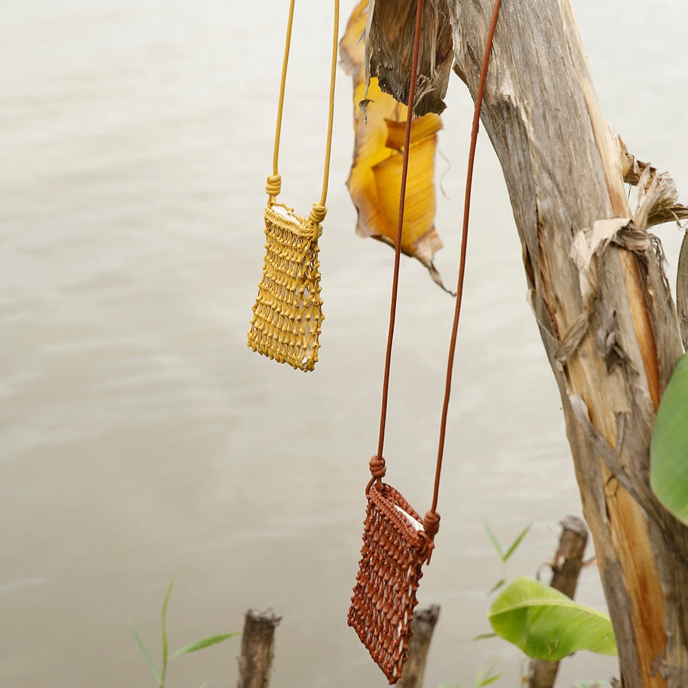 purses hanging on tree
