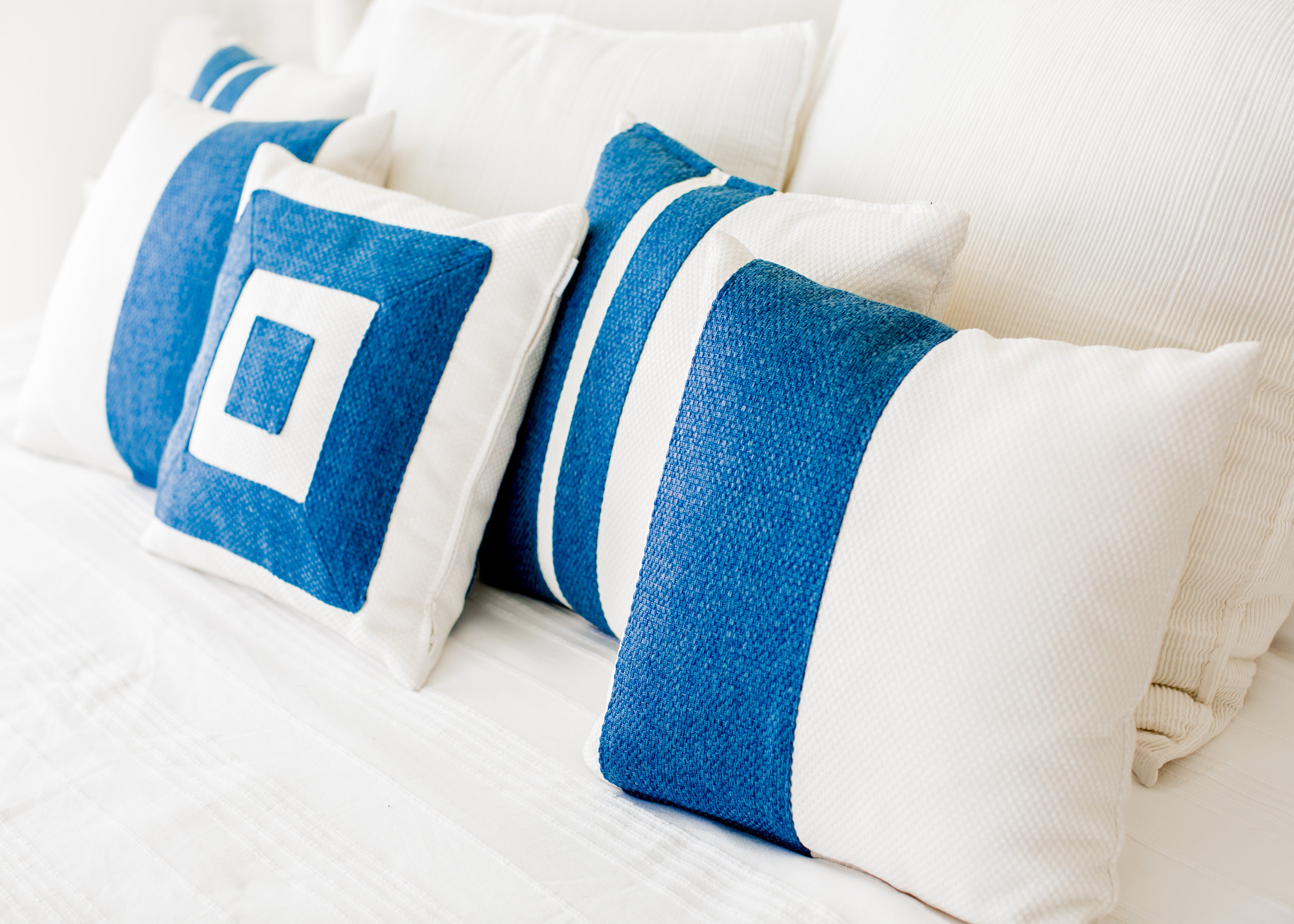 Themis Z handmade cushion adorned with a hand-stitched pattern.
